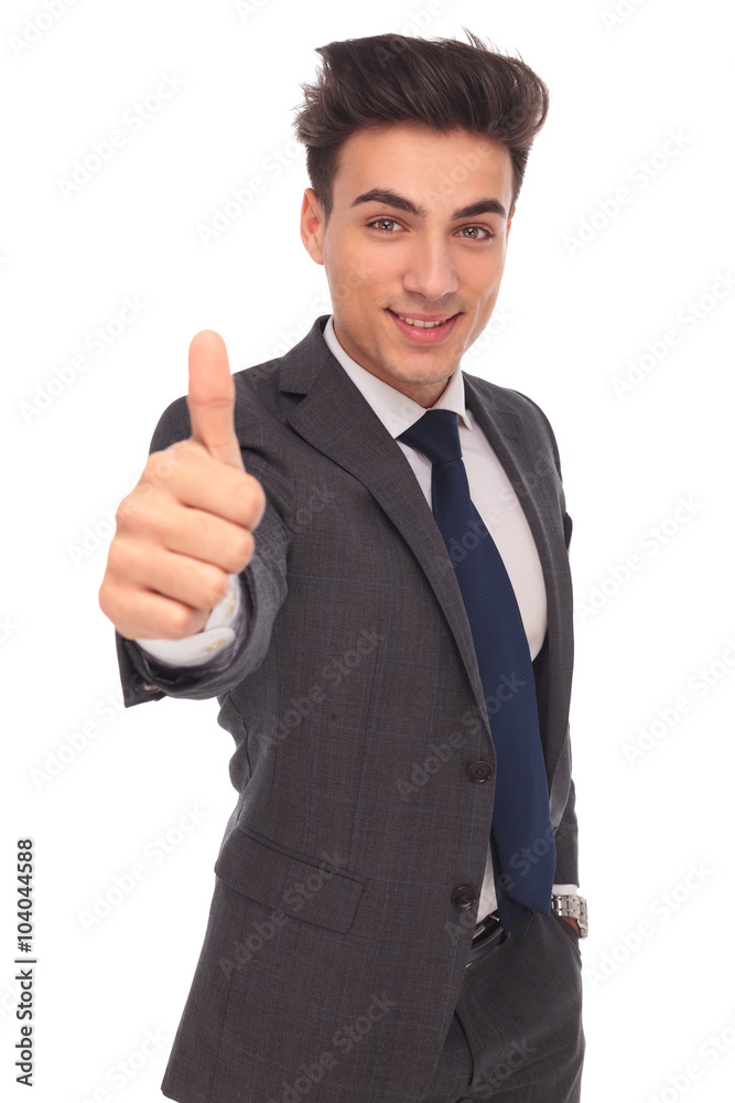 happy young business man making the ok hand sign happy young business man making the ok hand sign