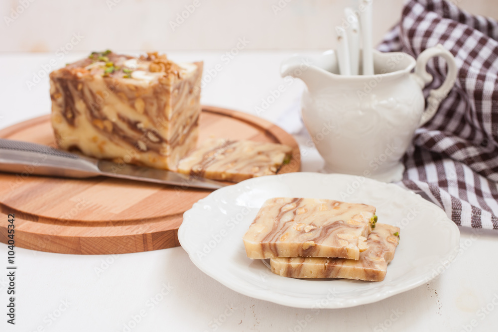 creamy fondant with a shredded nut on a plate, selective focus creamy fondant with a shredded nut on a plate, selective focus
