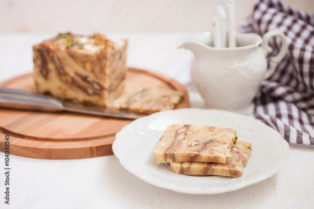 creamy fondant with a shredded nut on a plate, selective focus creamy fondant with a shredded nut on a plate, selective focus