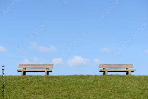 Park bench on meadow
