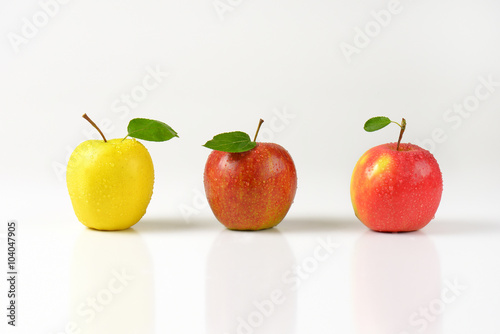 three freshly washed apples