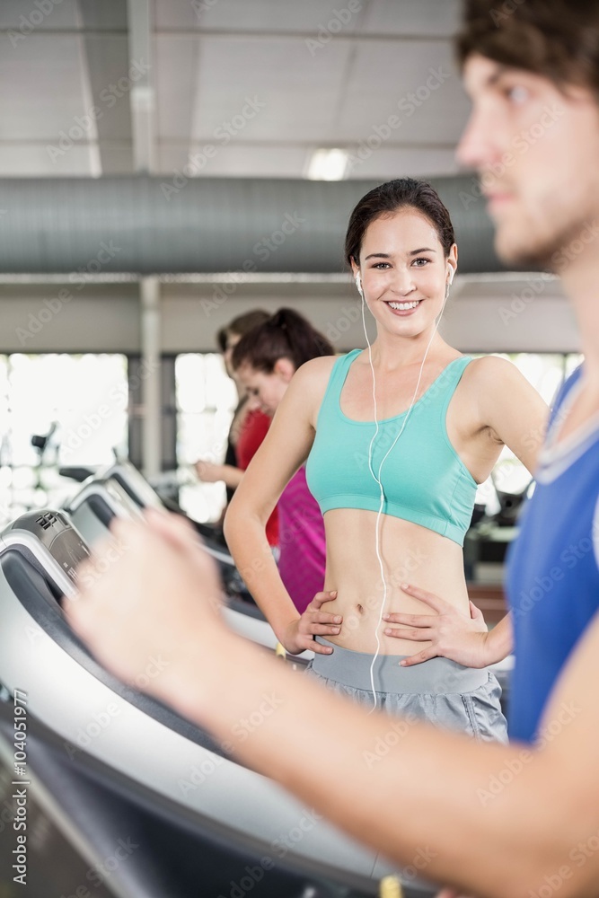 Fit woman running on treadmill Fit woman running on treadmill