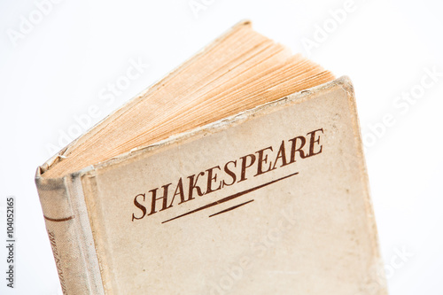 An old book by Shakespeare on white background