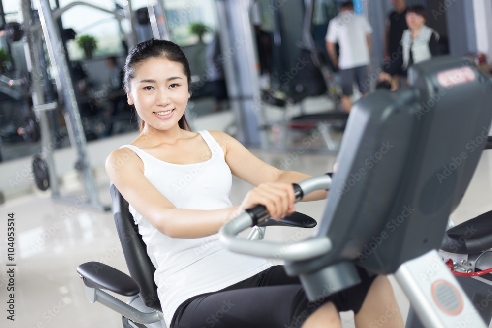 beautiful girl working out in modern gym beautiful girl working out in modern gym