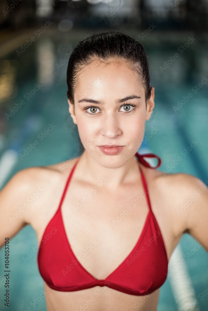 Pretty brunette in swimsuit with hands on hips Pretty brunette in swimsuit with hands on hips