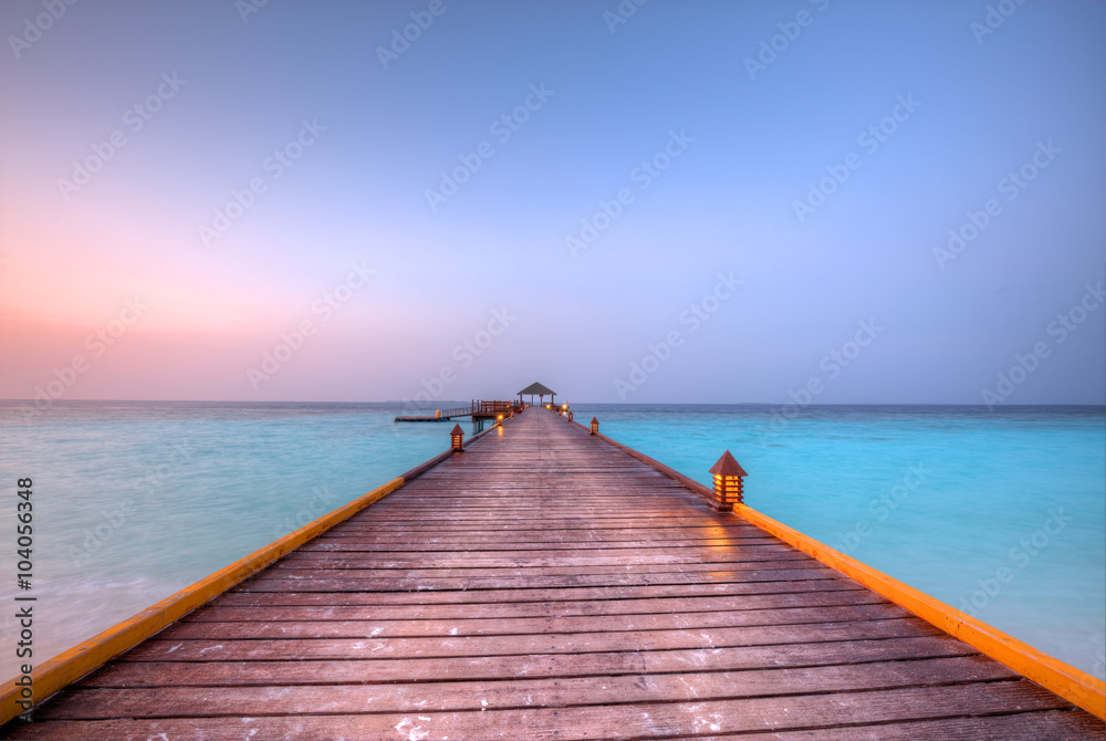 Fototapeta premium Wooden jetty in sunset