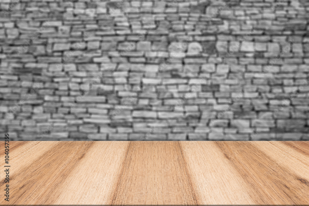 Empty top wooden table and natural stone wall background. For pr