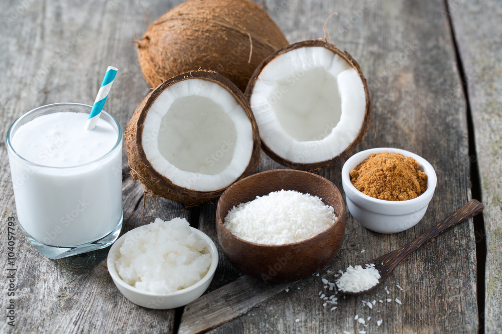 coconut sugar, milk and oil on wooden surface coconut sugar, milk and oil on wooden surface