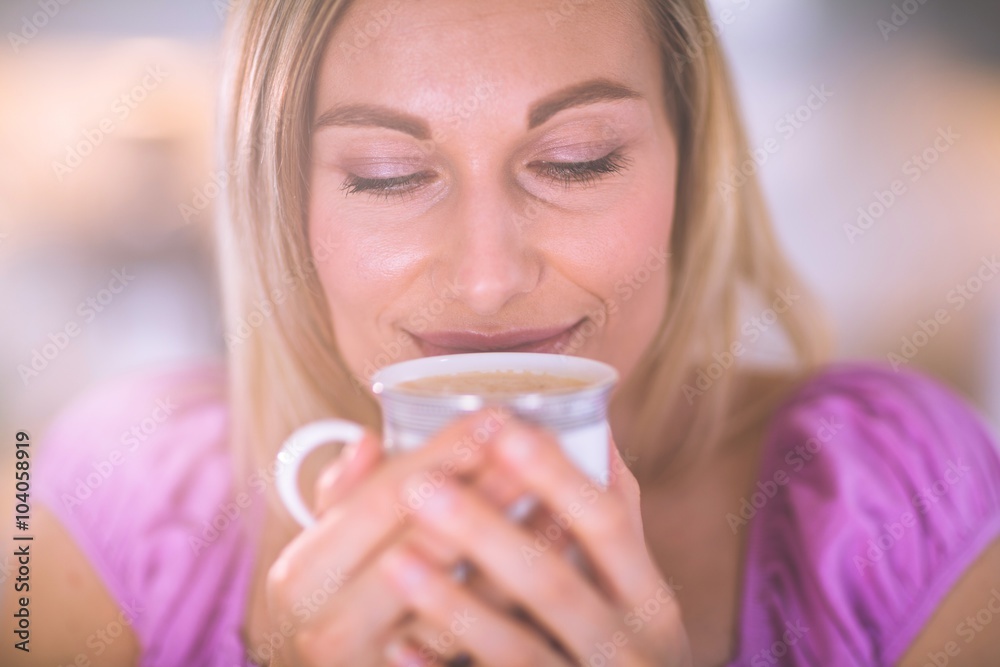 Pretty blonde woman having coffee Pretty blonde woman having coffee