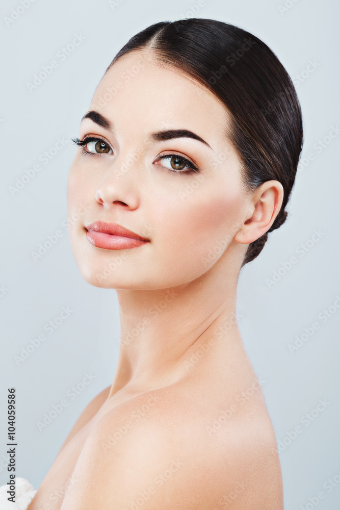 Gorgeous girl with dark hair at gray studio background Gorgeous girl with dark hair at gray studio background