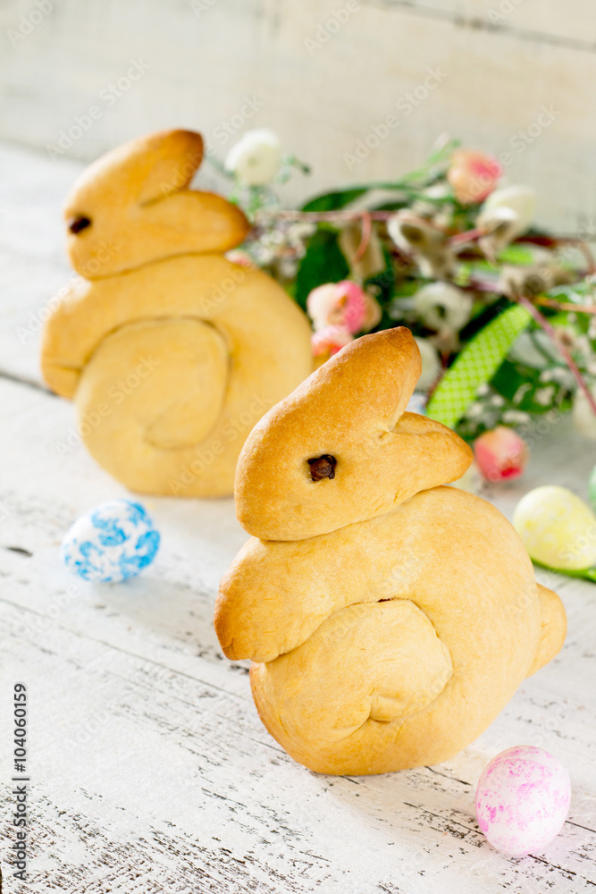 Baking Easter bunnies on a white wooden table
