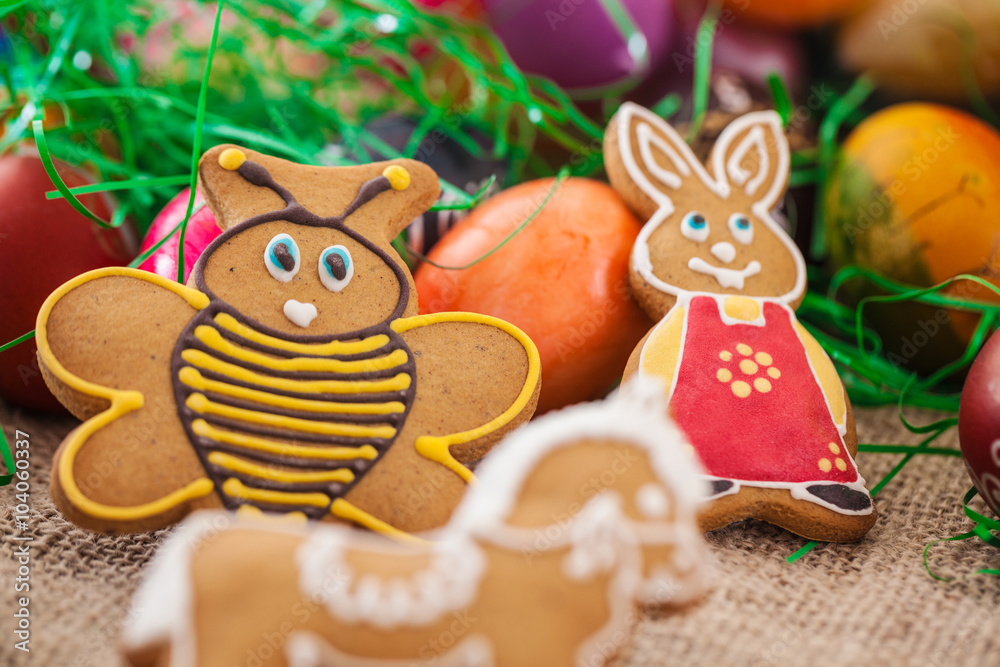 Close up of colorful Easter eggs and gingerbread cookies