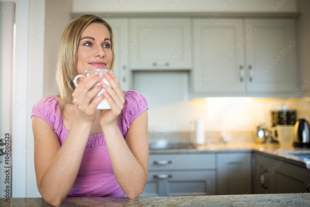 Pretty blonde woman having coffee