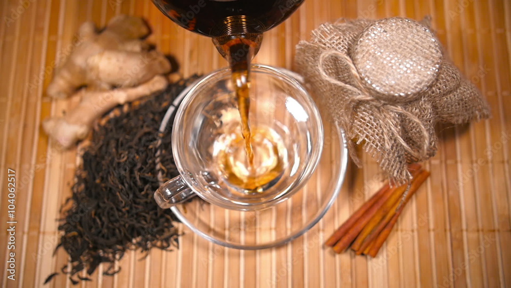 Pouring Tea with Scattered Tea, Honey, Ginger and Cinnamon Pouring Tea with Scattered Tea, Honey, Ginger and Cinnamon