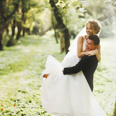 luxury stylish young bride and groom on the background  spring s