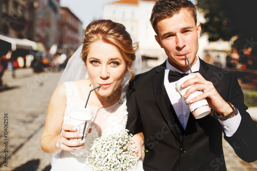 young luxury gorgeous happy bride and groom on the background of