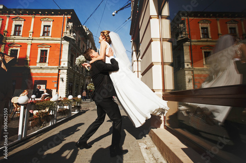cute elegant luxury couple on the background  spring the city of