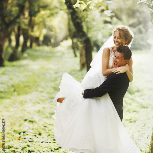 luxury stylish young bride and groom on the background  spring s