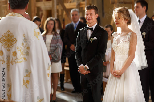 classic wedding ceremony of stylish young luxury bride and groom