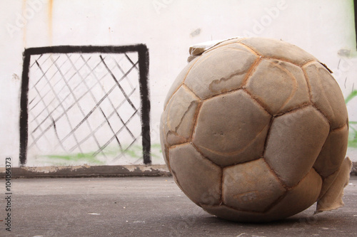 old  football on the concrete floor