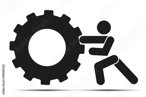Man pushes a wheel.