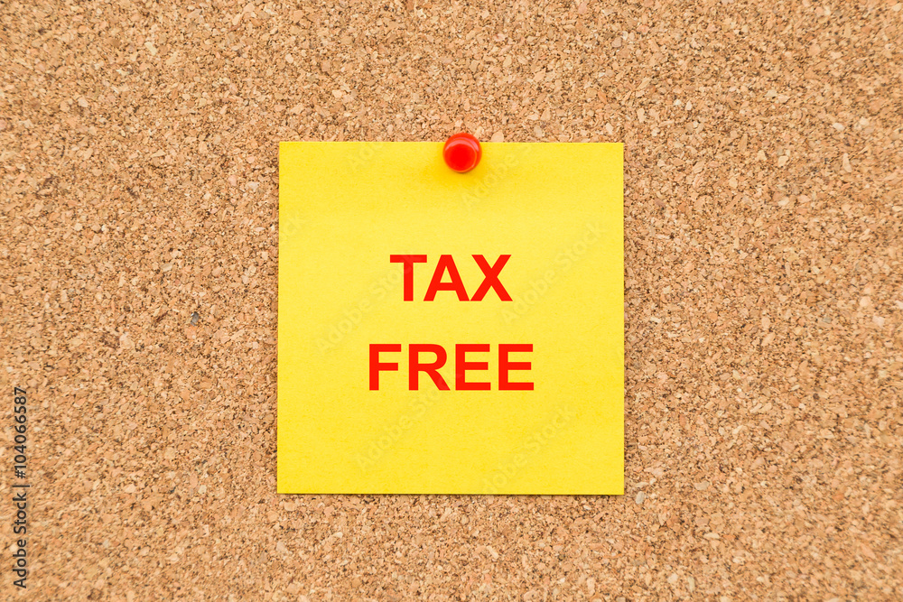 Yellow blank note and written TAX FREE for reminder. Yellow blank note and written TAX FREE for reminder.