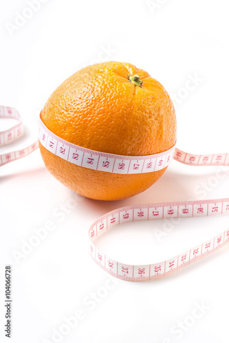 Weight losing concept with orange on white background