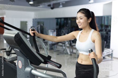 beautiful girl working out in modern gym © zhu difeng