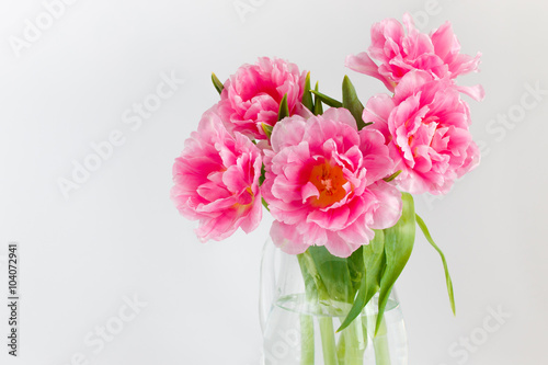 Fototapeta Naklejka Na Ścianę i Meble -  Pink tulips in a glass jar