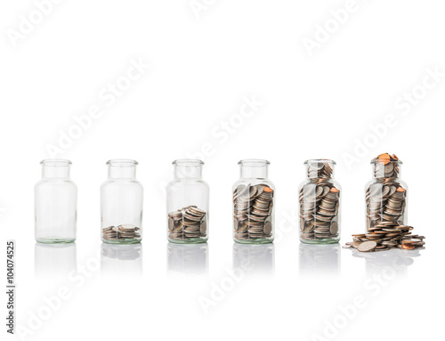Glass jars with coins, savings concept