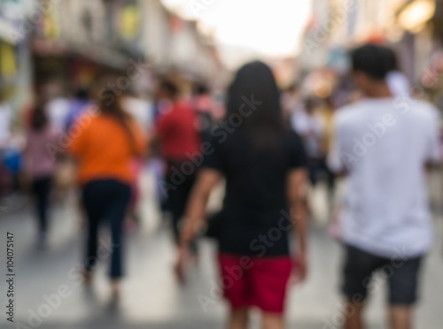 Blurred people walking on the street of old town