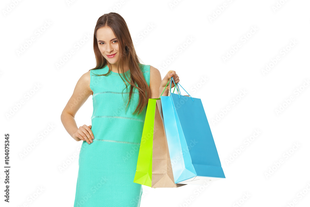Happy beautiful woman with shopping bags isolated on white.