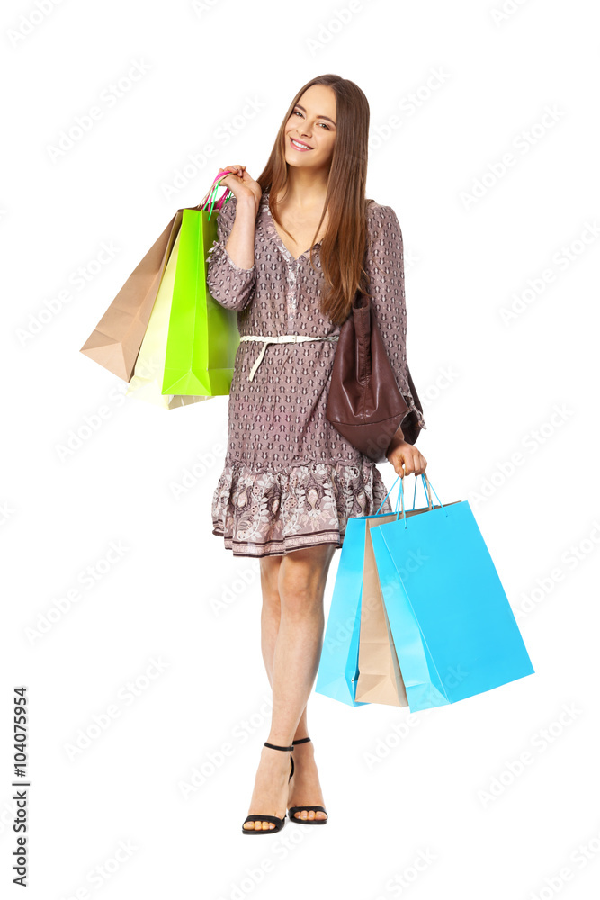 Fullbody portrait of beautiful woman with bags isolated on white