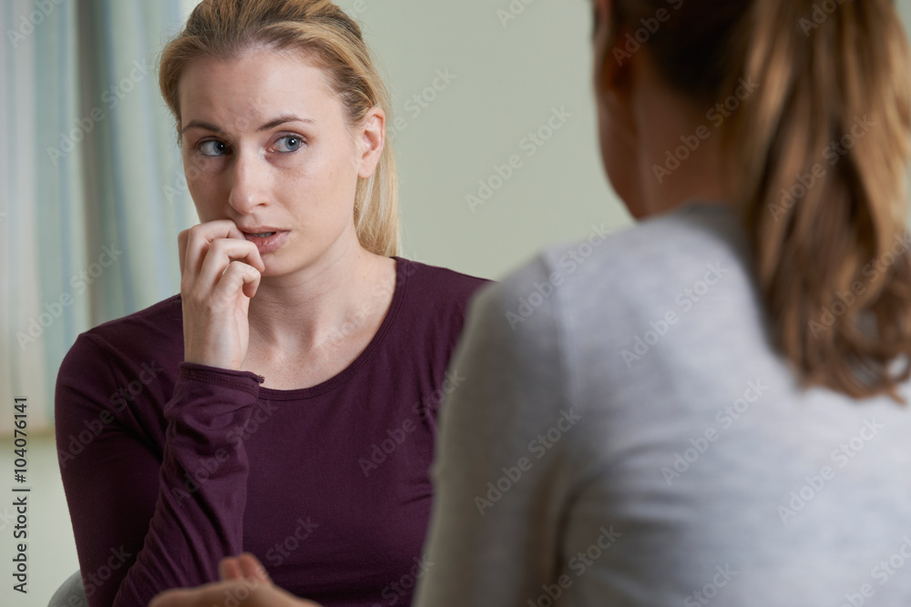 Young Woman Discussing Problems With Counselor Young Woman Discussing Problems With Counselor