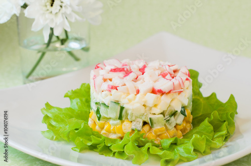 Layered salad of crab sticks and corn