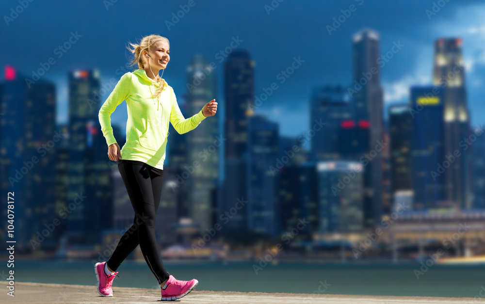happy woman jogging over city street background