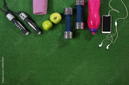 Fitness concept. Various elements over a grass background