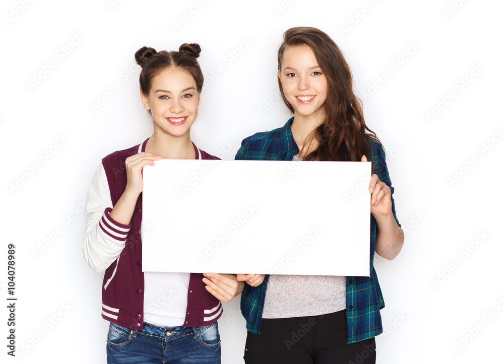 smiling teenage girls holding white blank board smiling teenage girls holding white blank board