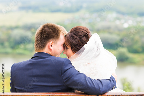 Bride and groom having a romantic moment on their wedding day 