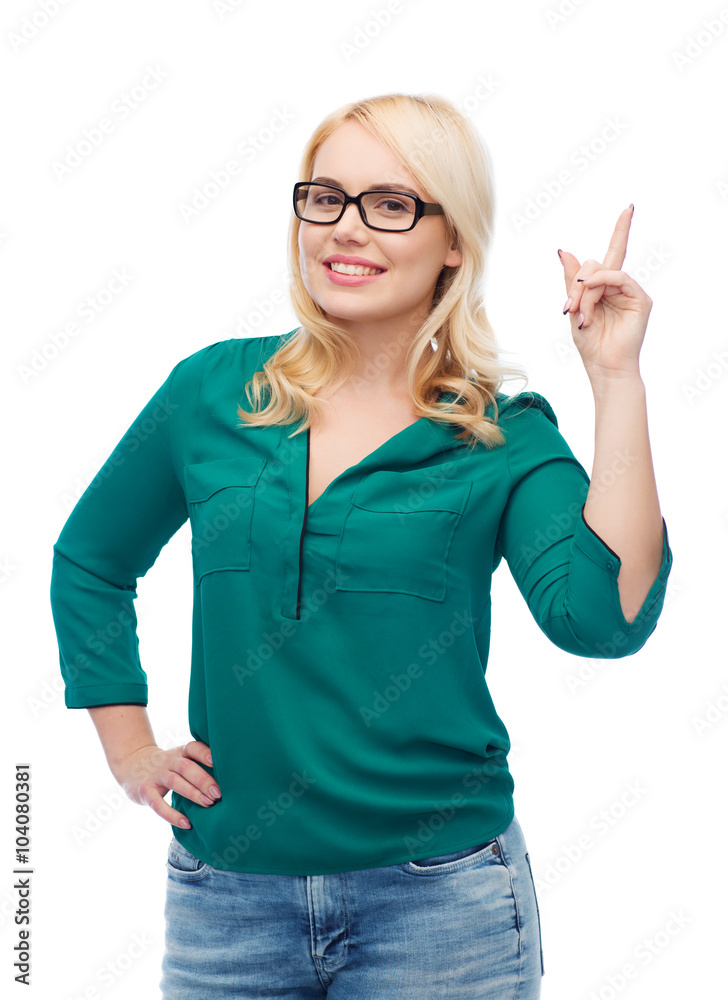 young woman with eyeglasses pointing finger up