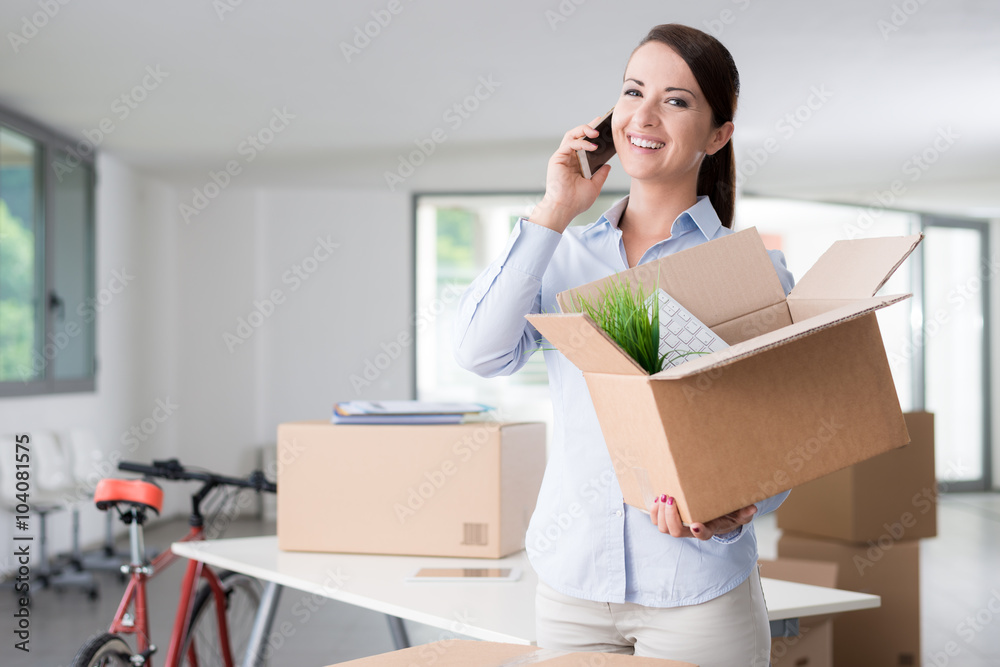 Beautiful woman on the phone with an open box Beautiful woman on the phone with an open box
