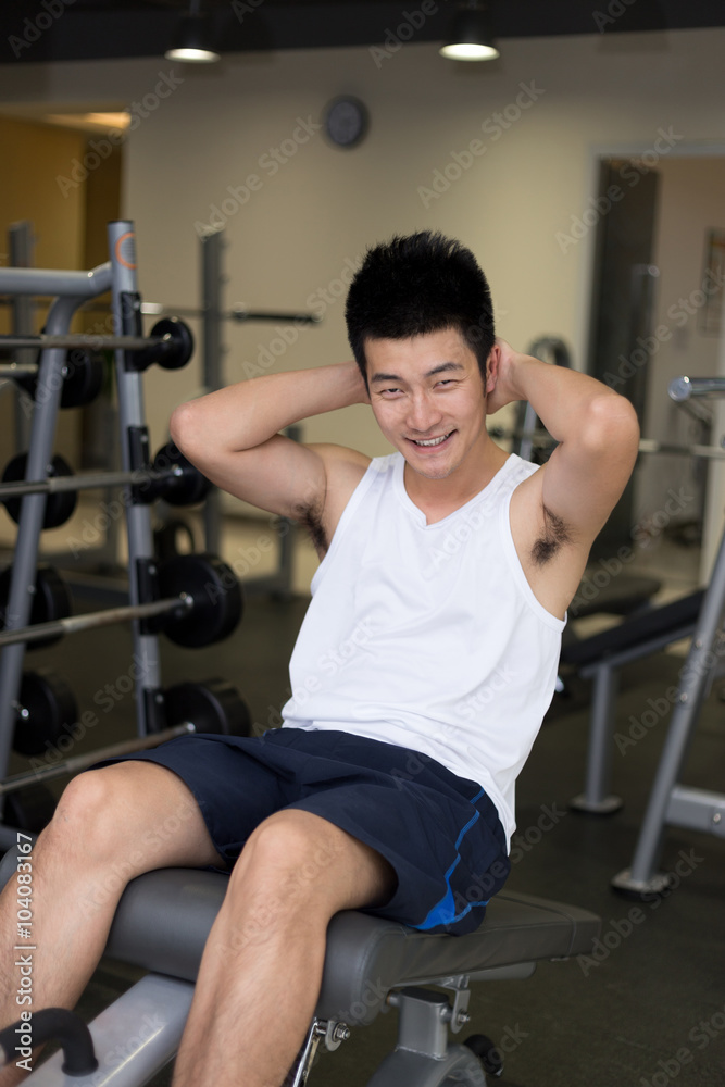 Fototapeta premium young man working out in modern gym