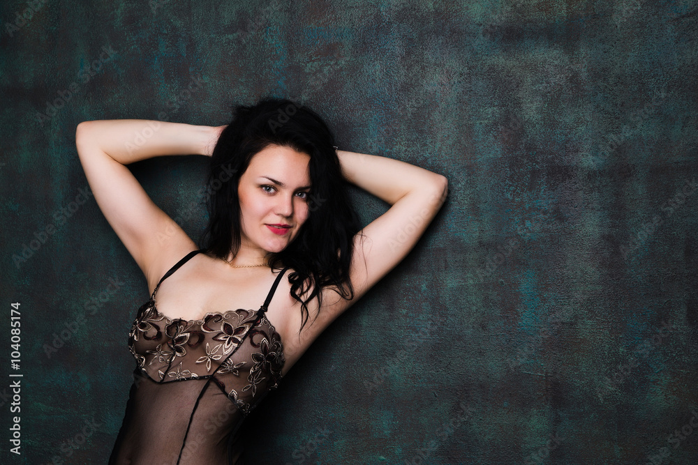 Naklejka premium sexy brunette young girl in underwear looking at camera