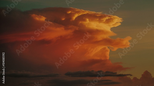 Storm Cloud Sunset (4K) - Sunset on desert cumulonimbus clouds. photo