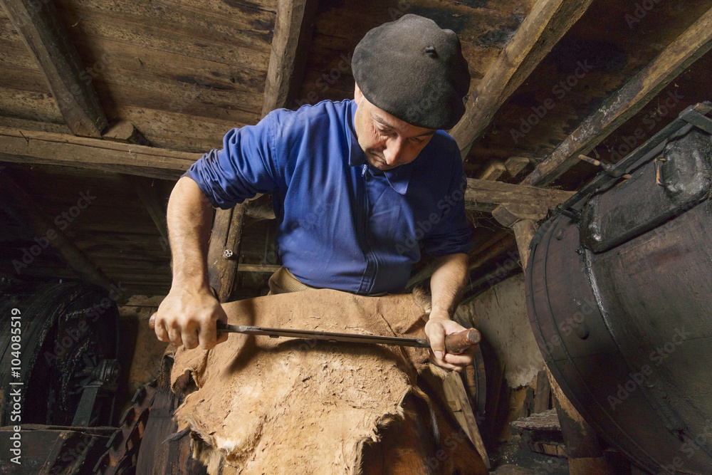 traditional tanner with old tools and machinery in the antique tannery traditional tanner with old tools and machinery in the antique tannery
