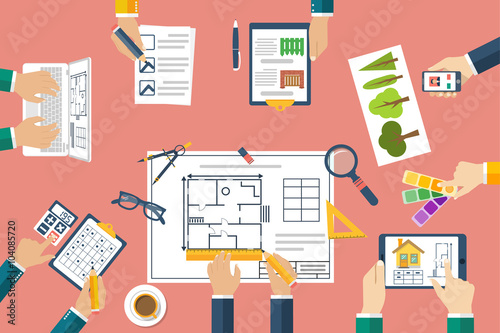 Team of architects working on a project. Architects discussing p