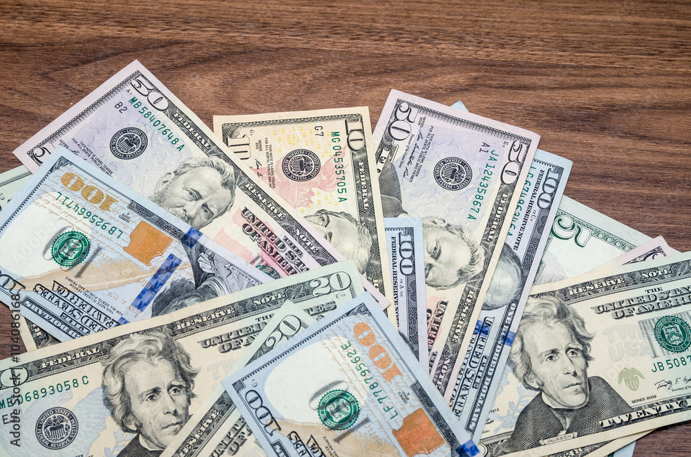 different dollar face-value banknotes on table different dollar face-value banknotes on table