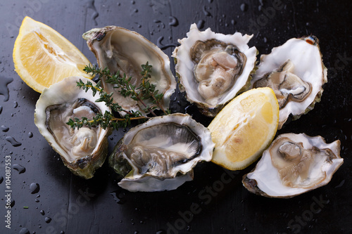Fresh Oysters in shell with lemon