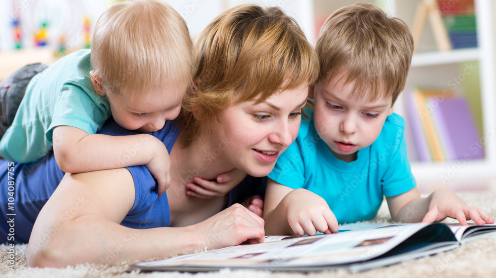 happy family lie on the floor and reading a book happy family lie on the floor and reading a book