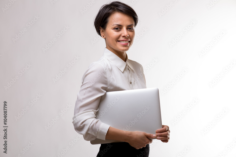 Young attractive business woman in a studio Young attractive business woman in a studio